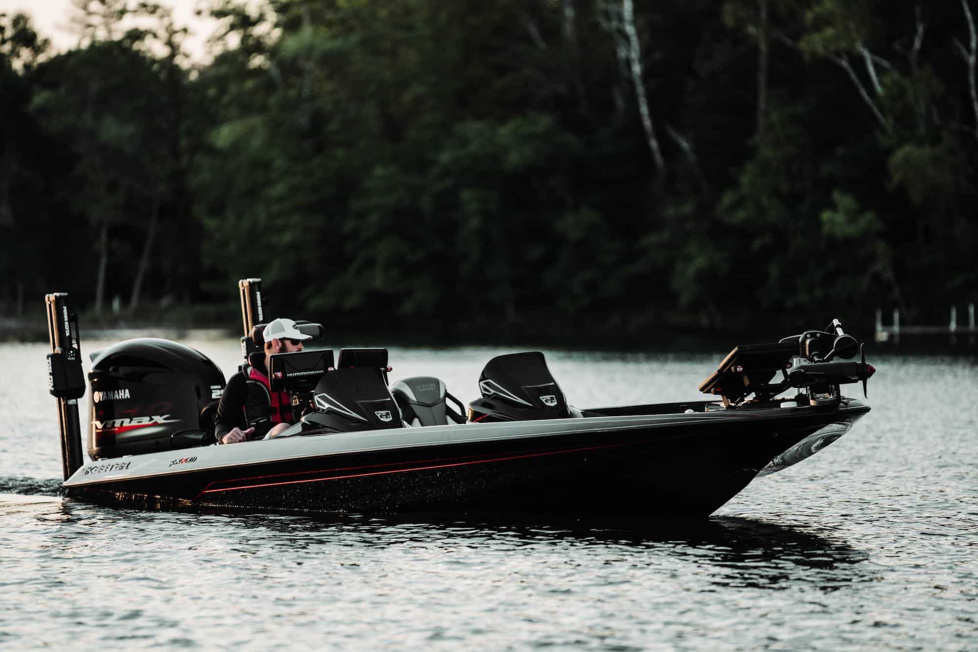 man driving bass boat on water