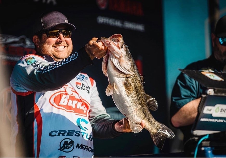 Professional Angler John Cox Holding a Bass