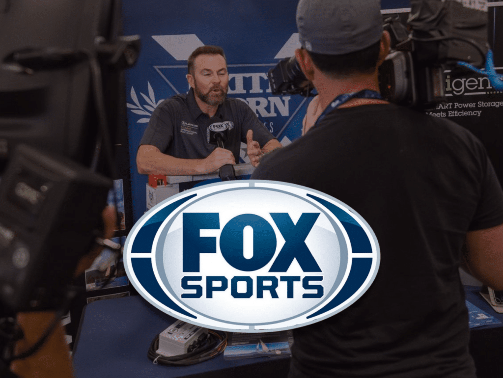 Fox Sports Logo Over Fox Sports Interview at Battle Born Batteries Booth at the Miami Boat Show